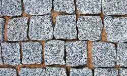 depositphotos_41577717-stock-photo-granite-cobblestone-pavement-texture-background